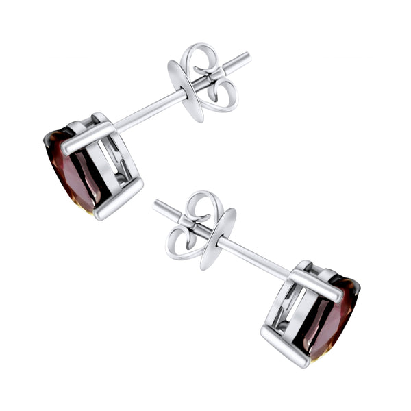 Platinum 7mm x 5mm ruby stud earrings