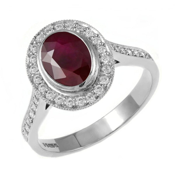 Platinum oval 1.38ct ruby & 0.40ct diamond cluster ring