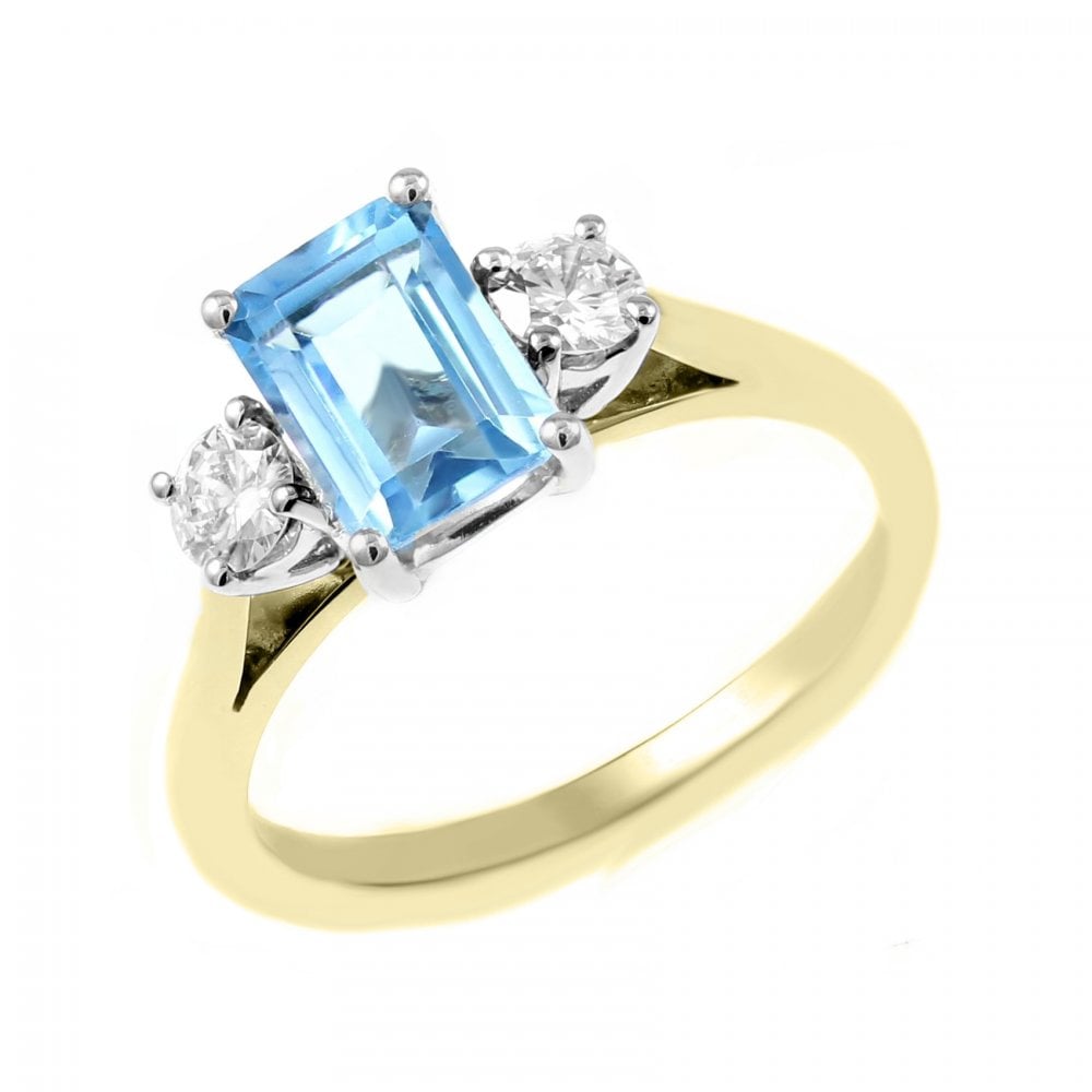 18ct yellow gold 1.10ct blue topaz & 0.30ct diamond 3 stone ring
