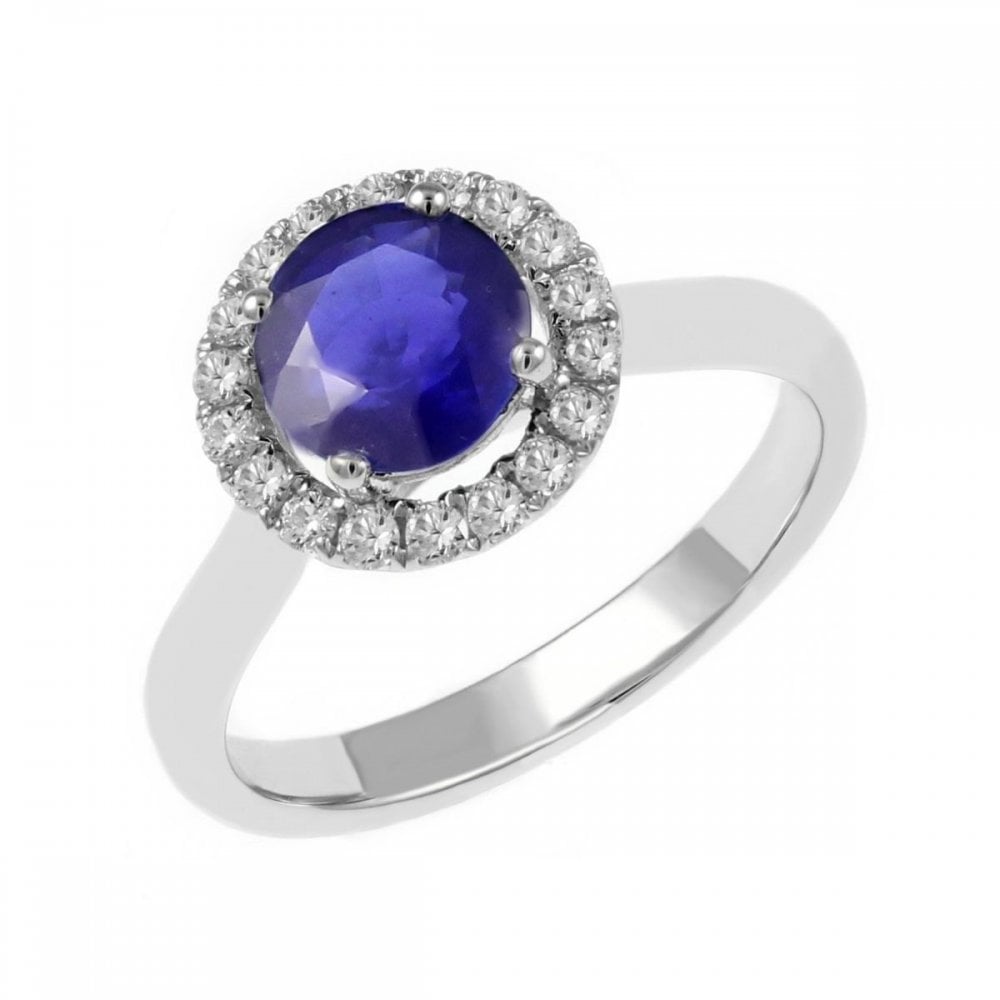 Platinum 0.84ct blue sapphire & 0.21ct diamond halo ring