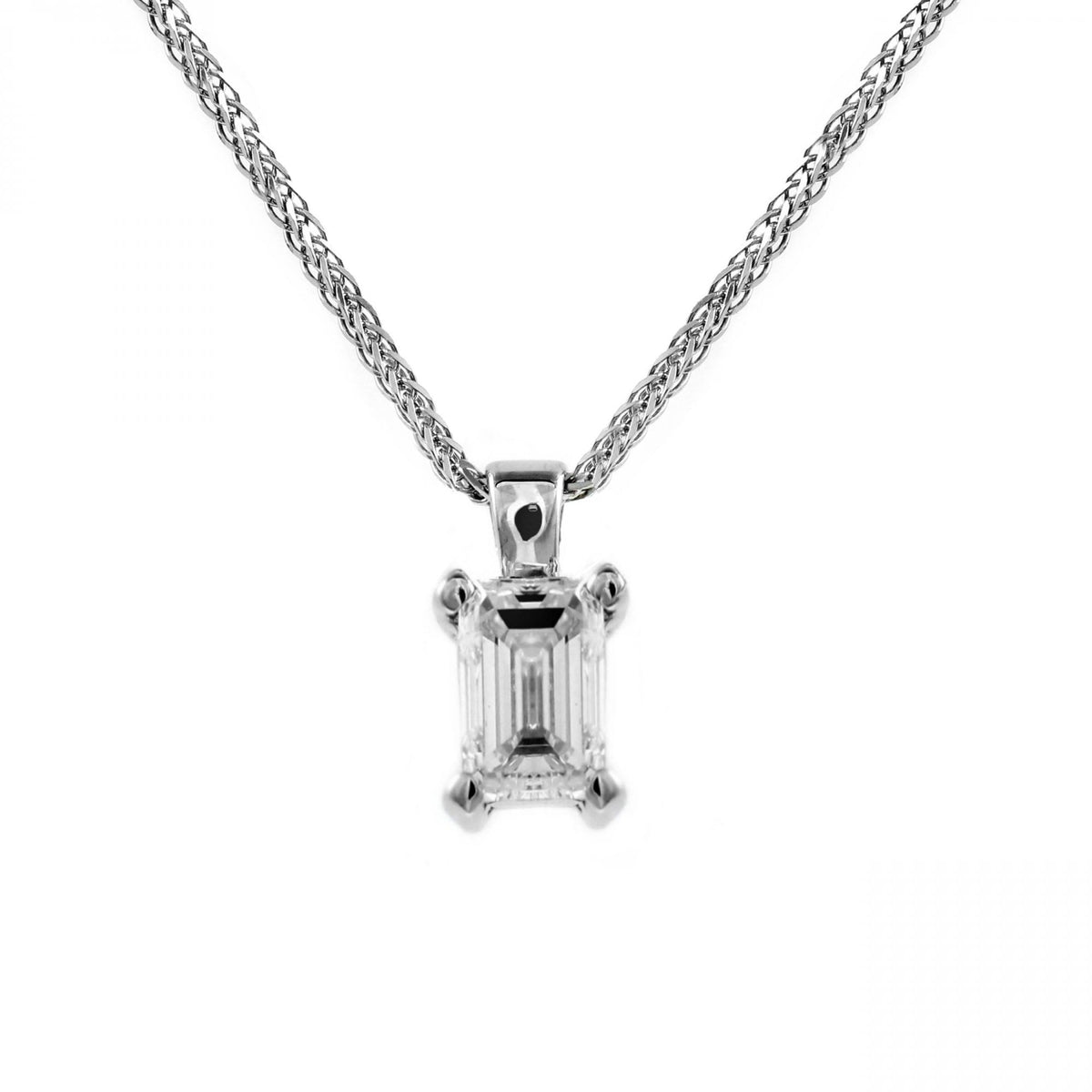 18ct white gold 1.31ct F VS2 IGL emerald cut diamond pendant