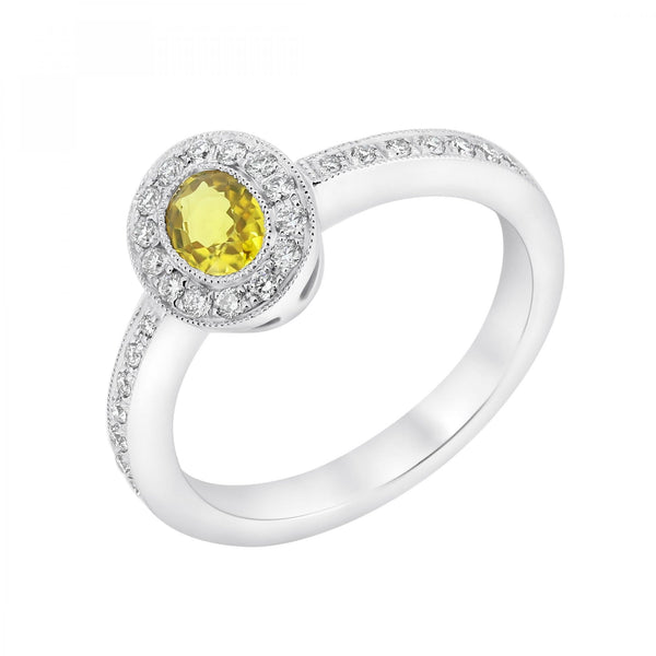 Platinum 0.60ct yellow sapphire & 0.22ct diamond cluster ring