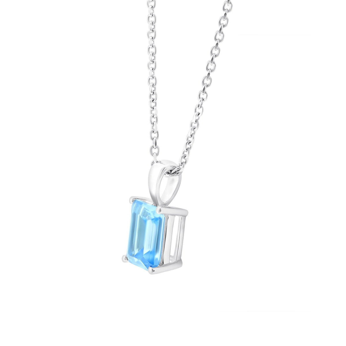 9ct white gold 8mm x 6mm emerald cut blue topaz pendant