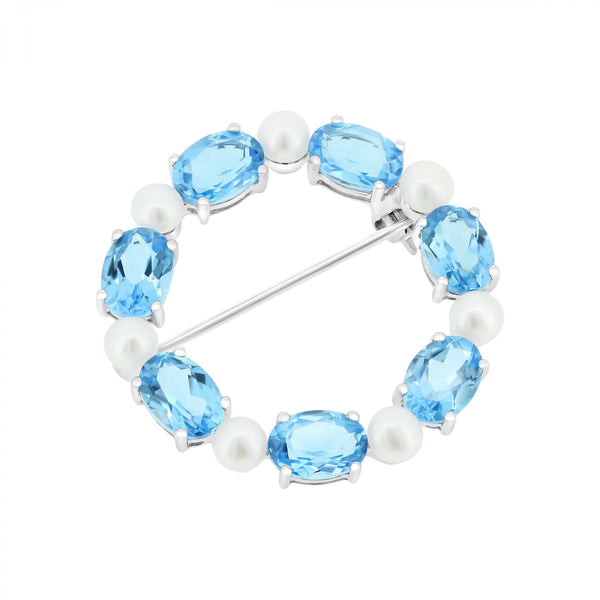9ct white gold oval 7x5mm blue topaz & round pearl brooch