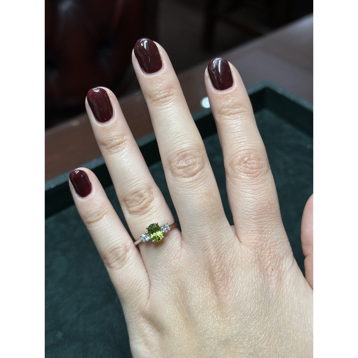 Platinum 0.93ct peridot & 0.25ct diamond 3 stone ring