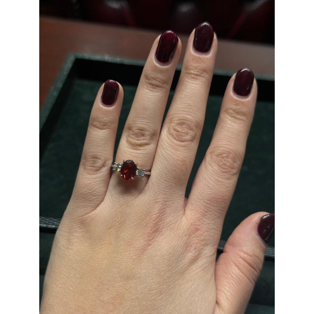 Platinum 1.10ct manderin garnet & 0.25ct diamond 3 stone ring