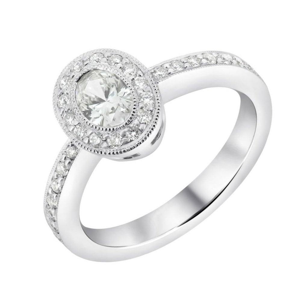 Platinum 0.34ct oval & 0.24ct round brilliant diamond halo ring