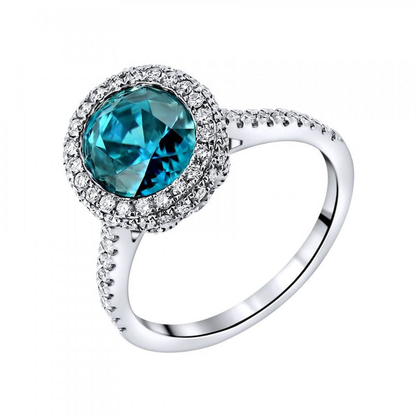 18ct white gold 4.29ct blue zircon & 0.66ct diamond halo ring